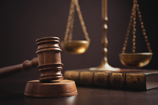 Judge's gavel and weight scale. Law and justice system.