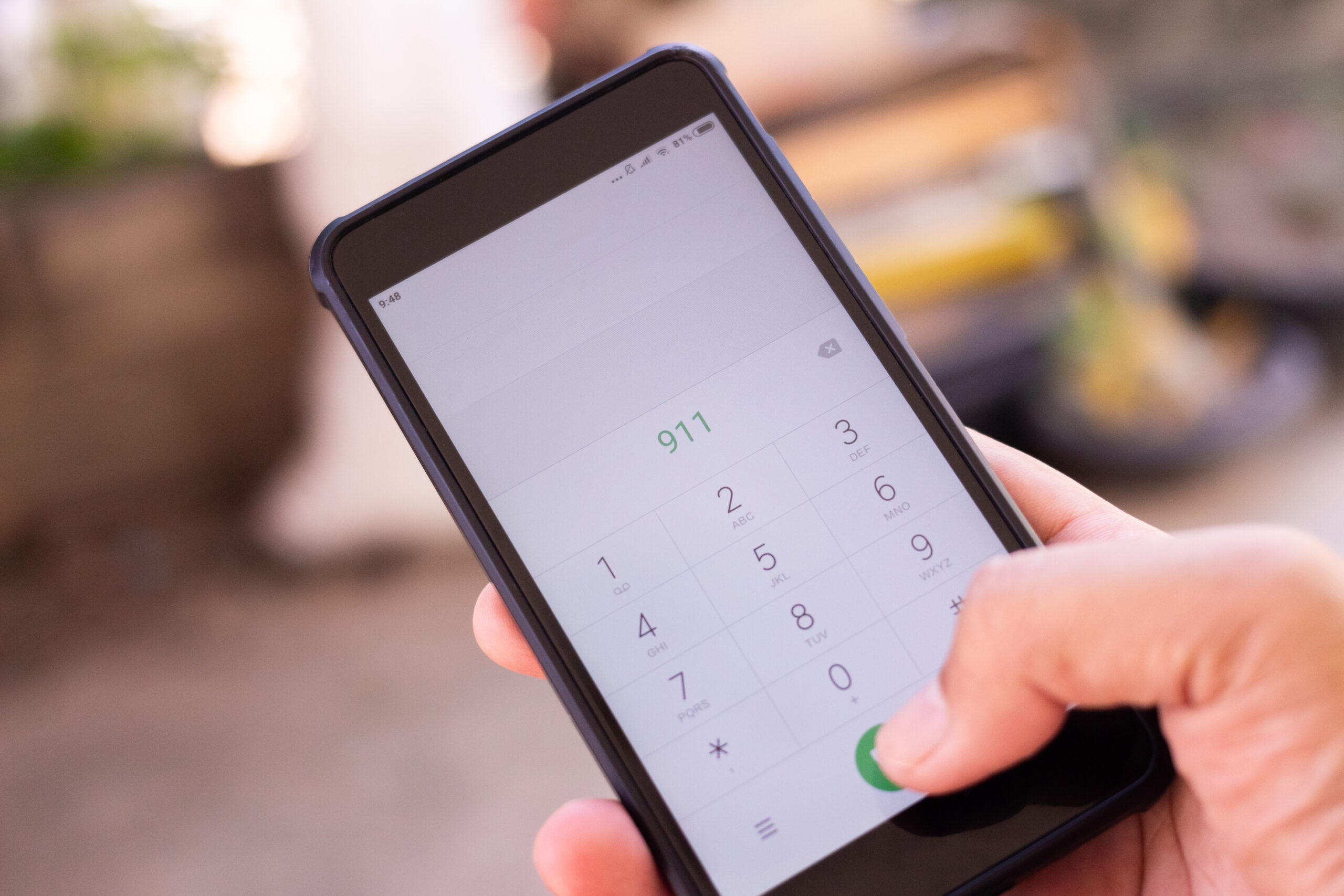 Emergency and urgency, dialing 911 on smartphone screen.